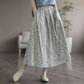 Artistic floral washed cotton midi skirt in light gray with a delicate floral pattern in soft blue and white tones