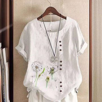 White linen printed casual shirt with embroidered dandelion designs and dark brown buttons down the front