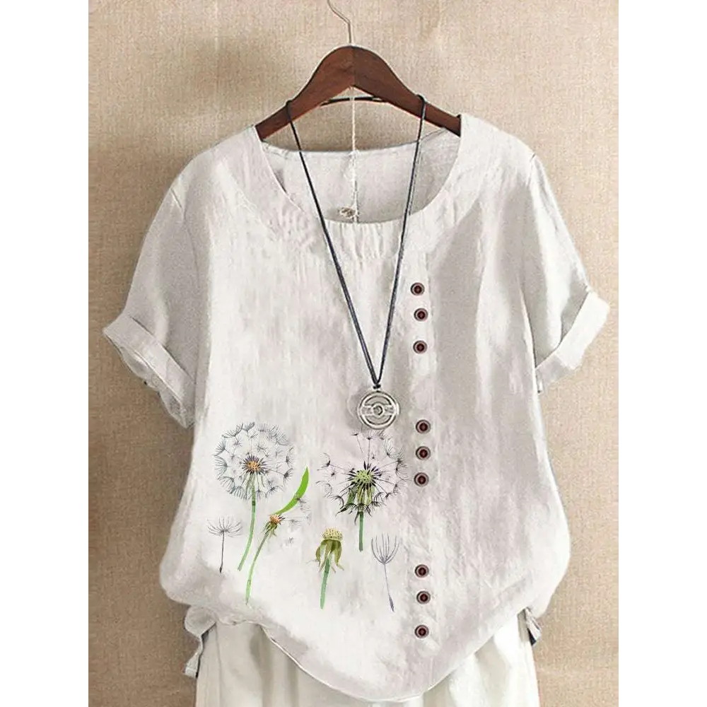 White linen printed casual shirt with delicate embroidered dandelion designs and brown buttons along the front