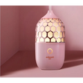 Asakusa pink aroma diffuser with pink honeycomb-patterned ceramic and gold accents releasing gentle mist