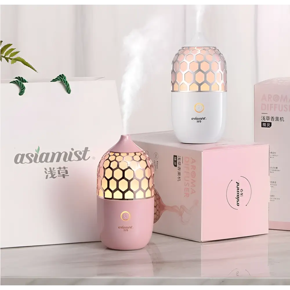 Asakusa pink aroma diffuser with pink honeycomb-patterned translucent top and smooth body releasing gentle mist