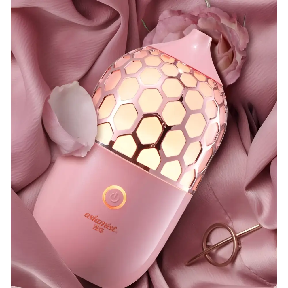 Asakusa pink aroma diffuser with pink honeycomb-patterned translucent top and smooth body releasing gentle mist