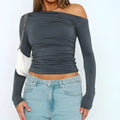 Dark gray asymmetric long sleeve solid color ruched top with off shoulder design in a soft fabric material