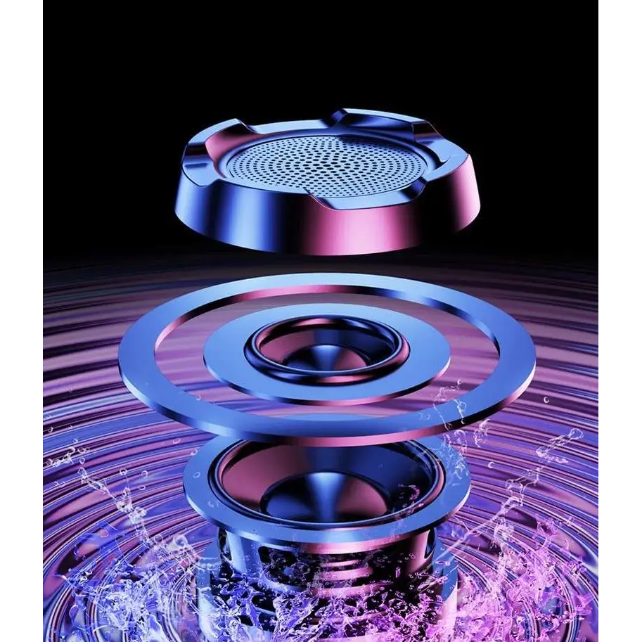 A sleek metallic multi-layered speaker driver with concentric rings in ambient light gaming bluetooth speakers