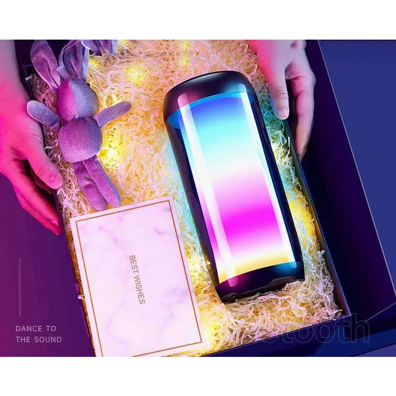 A sleek cylindrical led smart speaker with glossy black exterior and blue to pink ambient light gaming bluetooth speakers