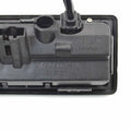 Black plastic audi a4 s4 avant reverse camera handle with molded housing and orange-and-white striped wiring connector back side