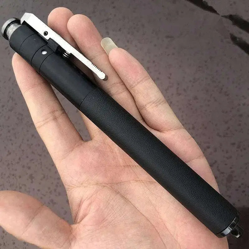 Black tactical self-defense baton with silver clip and textured grip featuring aluminium alloy construction and automatic spring mechanism