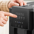 Black digital control panel of an automatic touch screen small coffee machine with illuminated icons and buttons