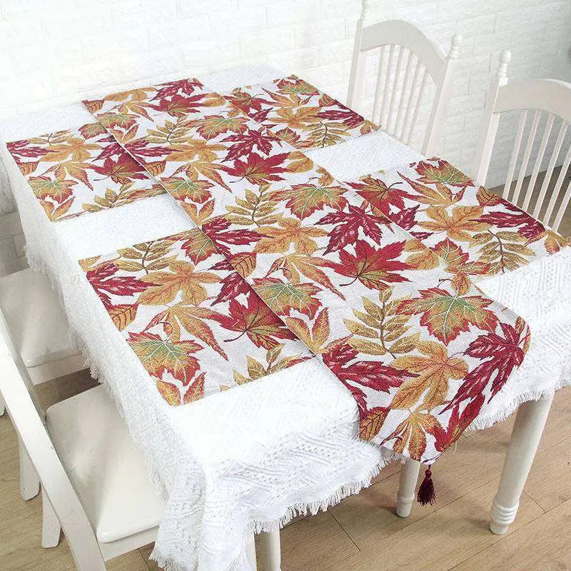 Autumn maple leaf decor table runner with red orange and yellow leaves on white background for seasonal table decor