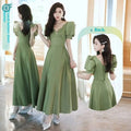 Avocado green sisters satin midi dress with puffed sleeves and v-neckline bow details in soft olive green satin