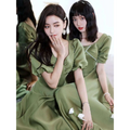 Olive green sisters satin midi dress with puffed sleeves and pearl embellishments in avocado green satin fabric