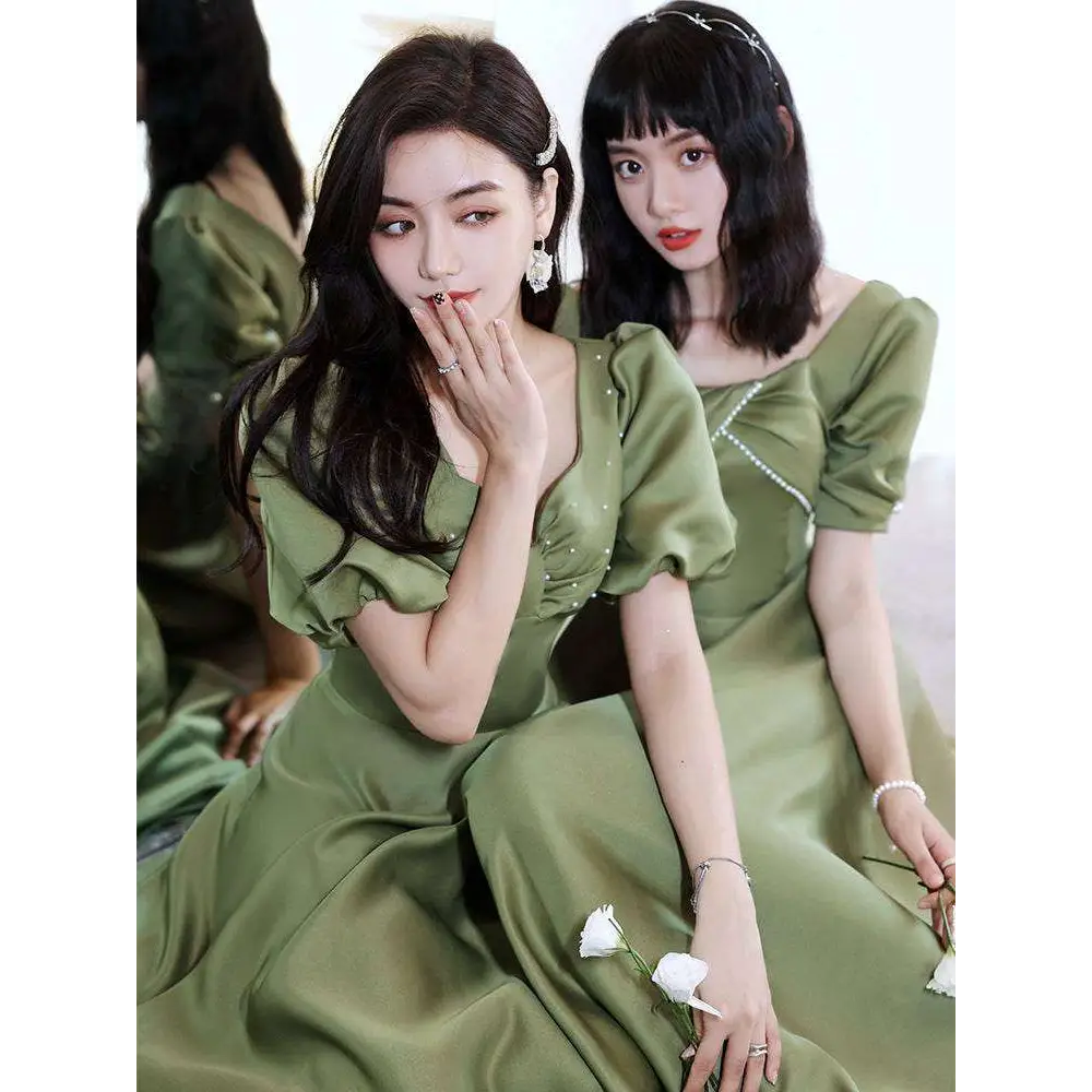 Olive green sisters satin midi dress with puffed sleeves and pearl embellishments in avocado green satin fabric