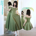 A flowing avocado green sisters satin midi dress with strapless off-shoulder design and back corset lacing