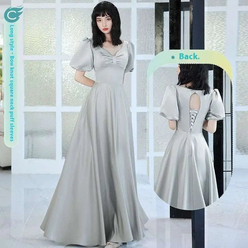 A flowing light gray satin midi dress with puffed sleeves and a bow-knot square neckline by avocado green sisters