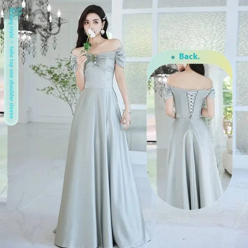 A flowing light gray satin midi dress with off-the-shoulder puffed sleeves and a corseted back from avocado green sisters