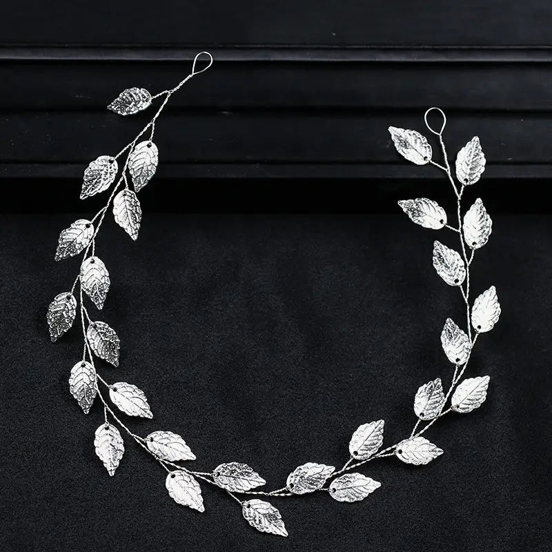 silver leaf hair band featuring a gold and silver leaf vine design with delicate textured leaves and slender branches