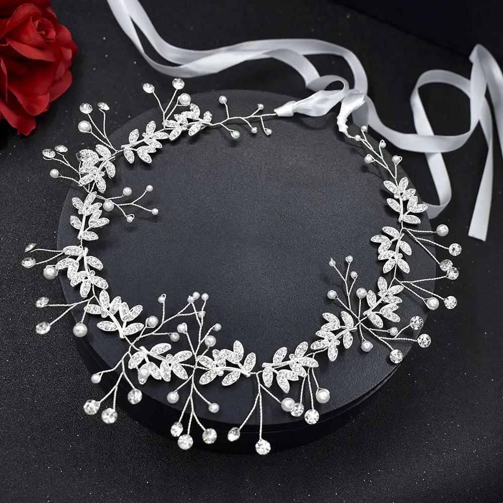 silver leaf pearl bridal hair band featuring a silver floral design adorned with sparkling rhinestones and delicate pearls made from band rhinestone alloy