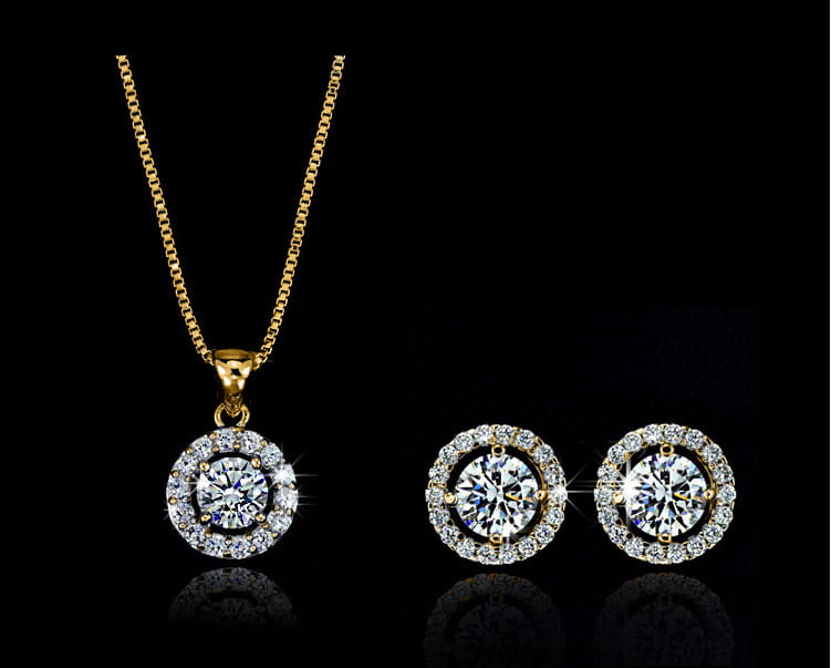 Elegant gold-toned diamond pendant necklace and matching stud earrings with central round-cut stones and diamond halos from silver diamond jewelry sets for luxury women’s fashion.