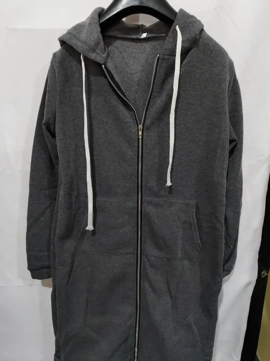 a dark gray full-length zip-up hoodie with white drawstrings and front pockets designed as a women zip up long thick hooded winter sweater for cold weather use