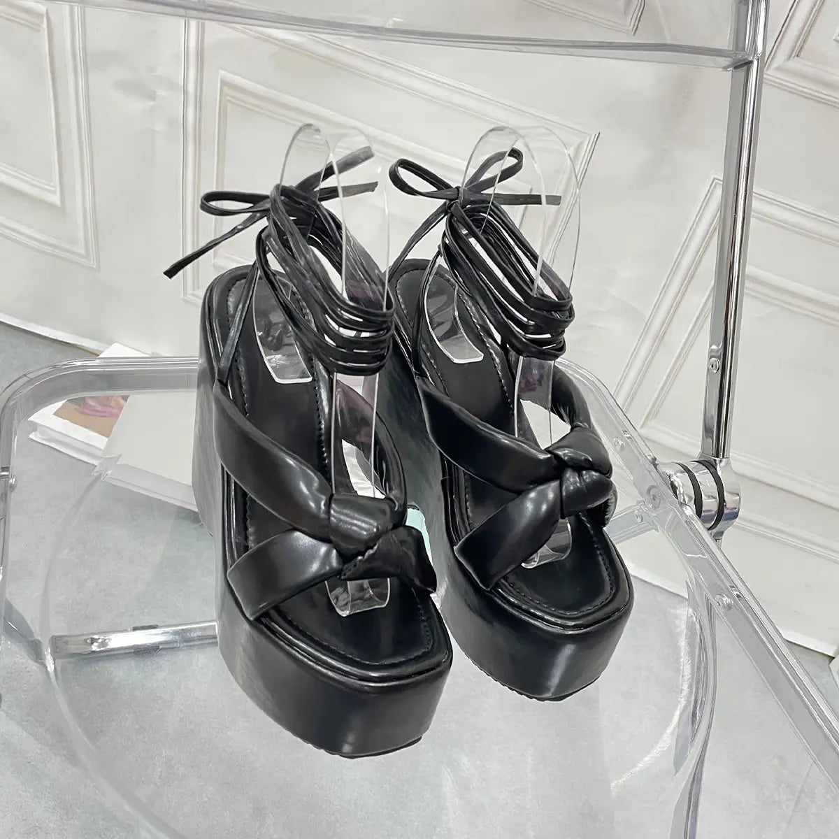 black platform wedge high sandals with thick glossy straps and tied ankle bows in place of pink platform wedge high heel ankle tie sandals