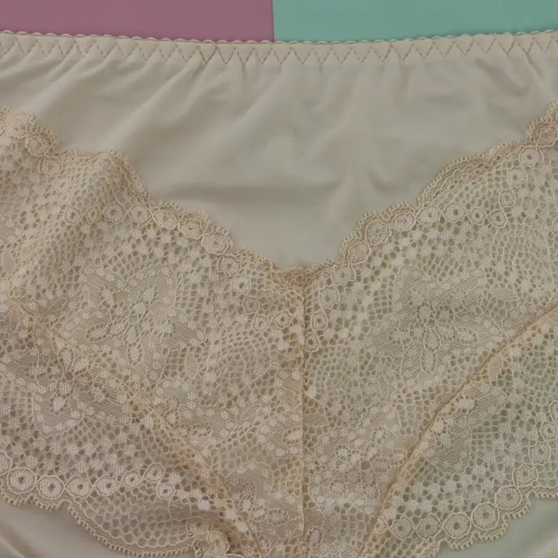 Cream-colored plus size underwire lingerie set featuring lace trim underwear with delicate floral patterns and a soft satin-like inner lining.
