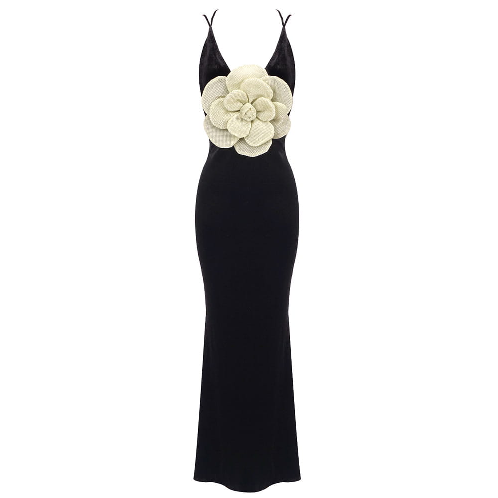 black camisole backless slim fit velvet gown with prominent cream-colored textured floral embellishment at the bust
