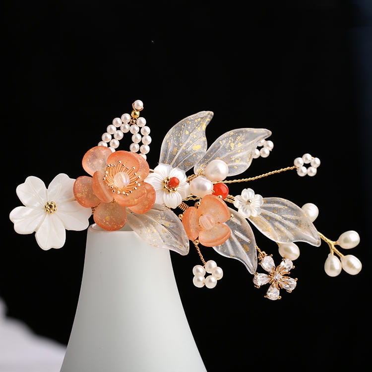 Hanfu ancient style handmade fringed floral hair crown featuring translucent leaves, peach and white resin blossoms with gold detailing, accented by pearls and a small crystal flower.