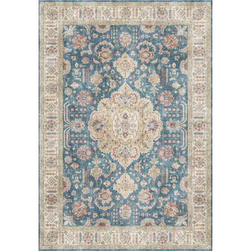 antique-style short pile area rug in faded blue and cream featuring intricate floral and geometric patterns for a luxury women’s fashion or plus size dresses bikinis boutique setting.