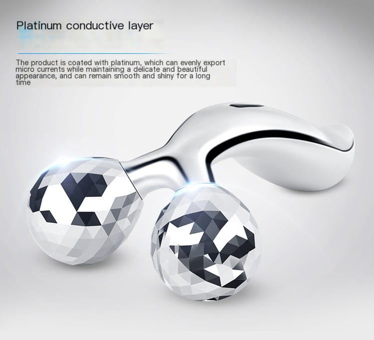 Silver platinum-coated facial roller massage device with two faceted gemstone-like spheres for skincare massage device image.