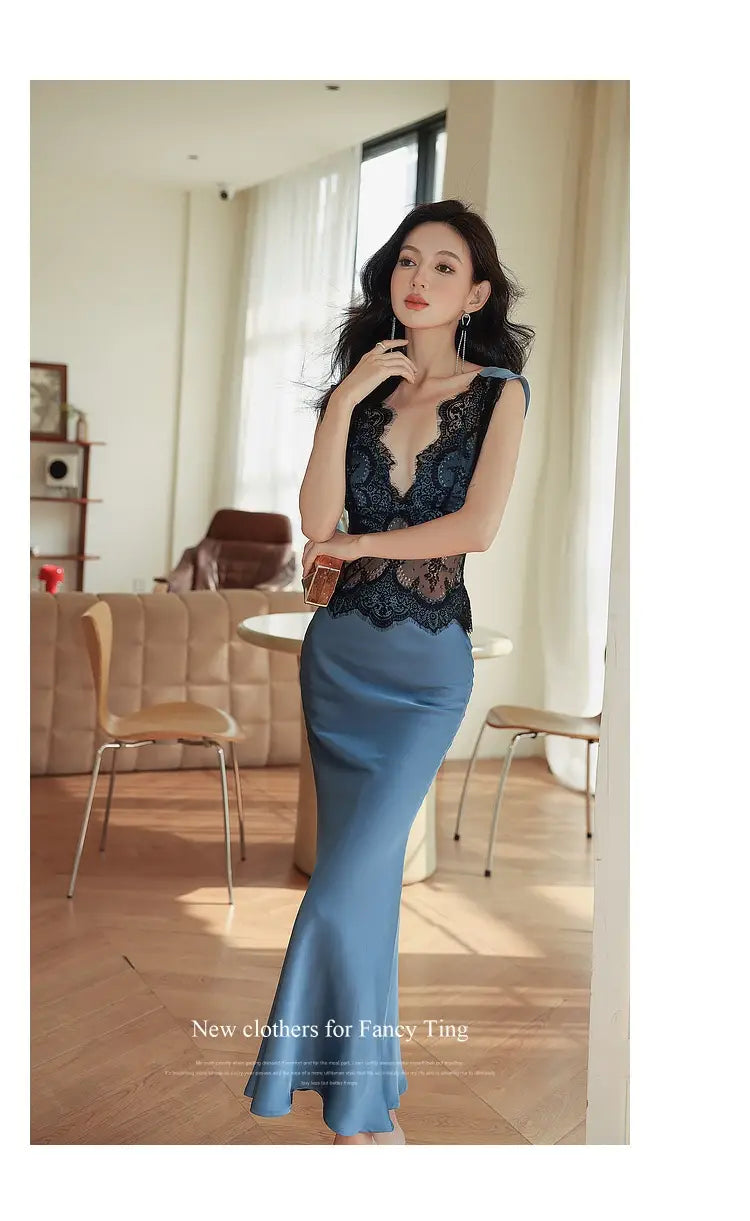 a blue sleeveless lace sheath dress featuring a navy blue lace bodice with a deep v-neckline and a matching satin skirt in a flowing mermaid silhouette