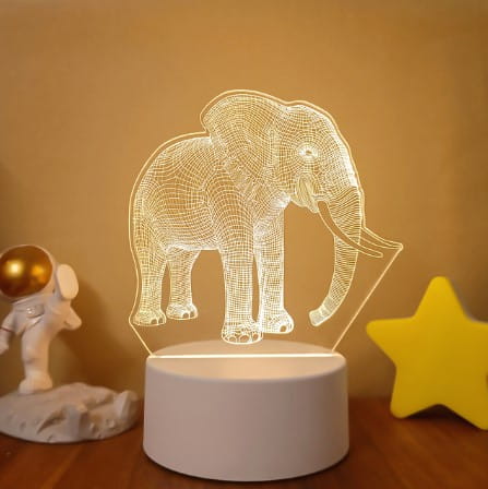 A glowing white wireframe elephant 3d led lamp with a minimalist base featuring colorful touch remote control lights for adjustable ambiance.