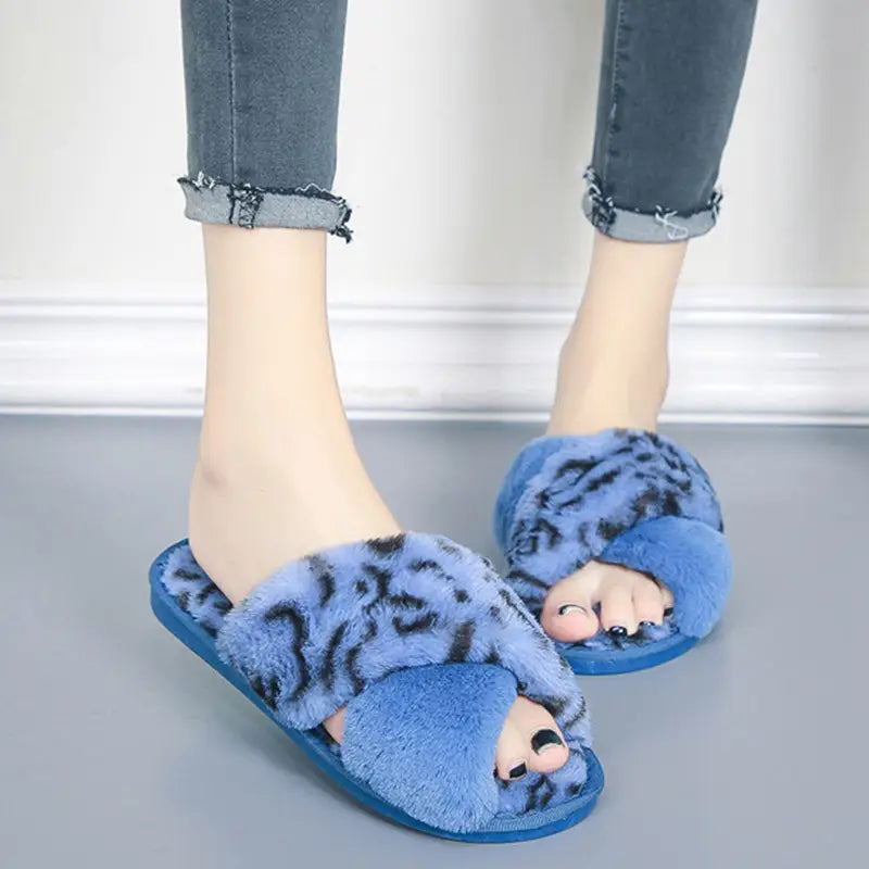 blue fuzzy slip-on sandals featuring a leopard plush upper designed as slippers leopard plush for comfortable indoor use.
