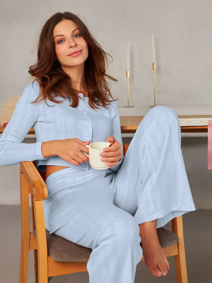 light blue ribbed knit pajama set with a cropped top and wide-leg pants paired with a white ribbed knit fashion cardigan long sleeve made of soft material for comfortable loungewear.