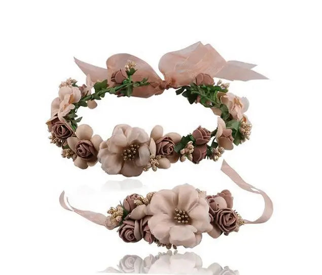 a delicate mauve wedding garland flower made of fabric roses and greenery with a matching wrist corsage as a blush rose wedding garland flower crown