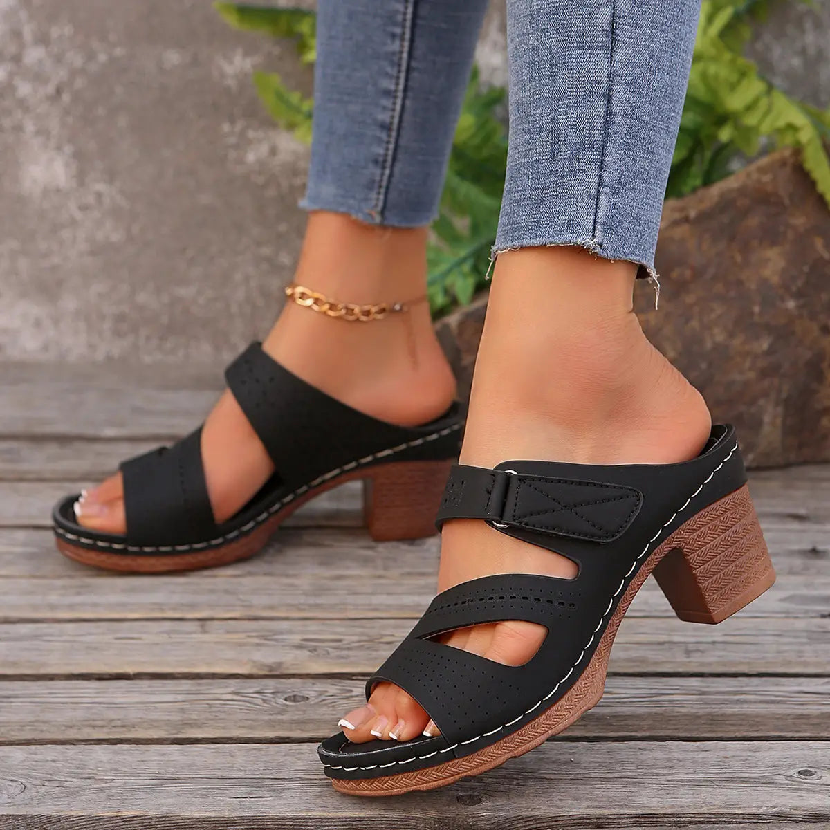 Black leather mule sandals with chunky wooden heels and white stitching ideal for summer casual chunky wear