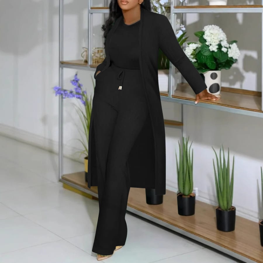 black long cardigan sunken with a drawstring waist and subtle front pockets as part of the cardigan sunken stripe wide leg pants set