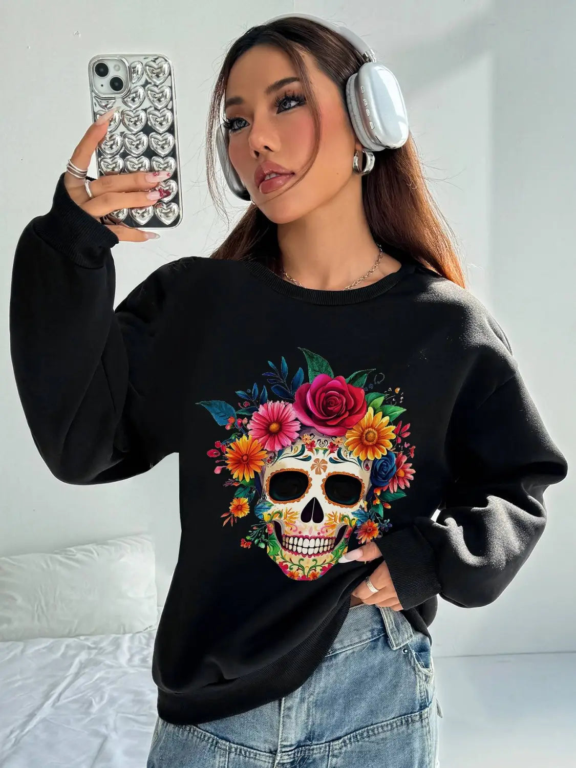 Black crew neck sweatshirt featuring a vibrant sugar skull design adorned with colorful roses and flowers, ideal for daily wear and basic long sleeve layering.