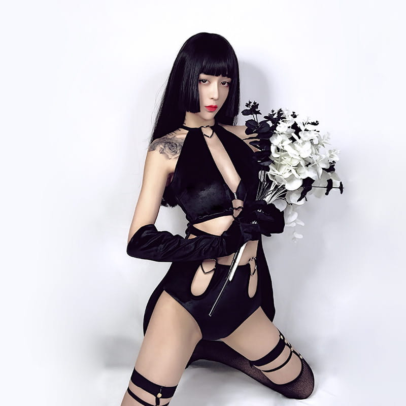 Black velvet halter bodysuit with cut-out details and long gloves designed as a female singer costume lead for nightclub dj female performances.