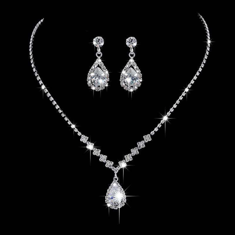 a silver-toned rhinestone zircon water drop necklace and earrings set featuring a central teardrop pendant and matching drop earrings adorned with clear crystals
