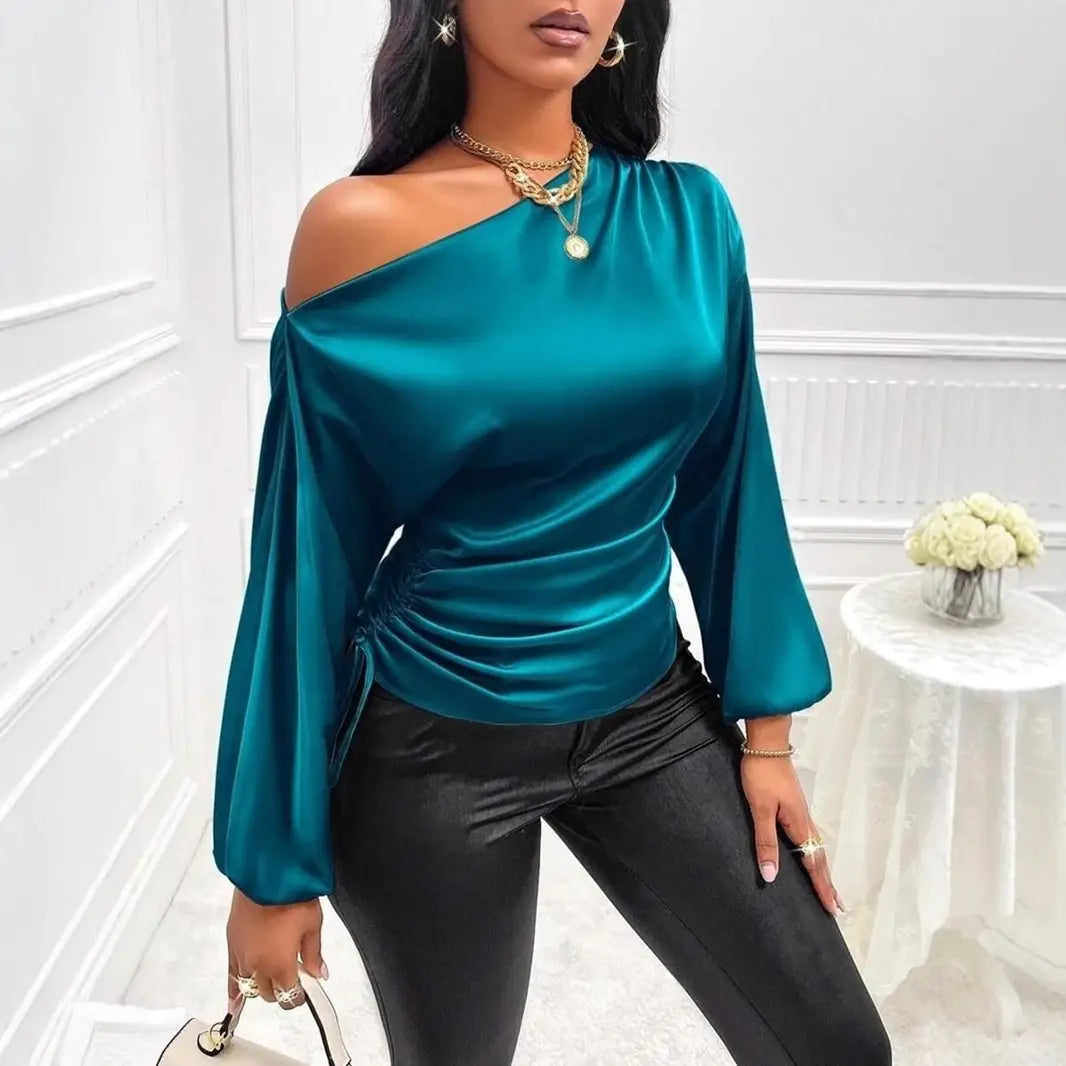 Teal satin shirt asymmetric long sleeve top featuring one shoulder design with ruched waist made from smooth satin material.