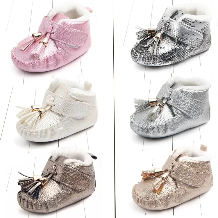 pink metallic tassel baby shoes with soft white fur lining designed as non-slip baby shoes for toddlers