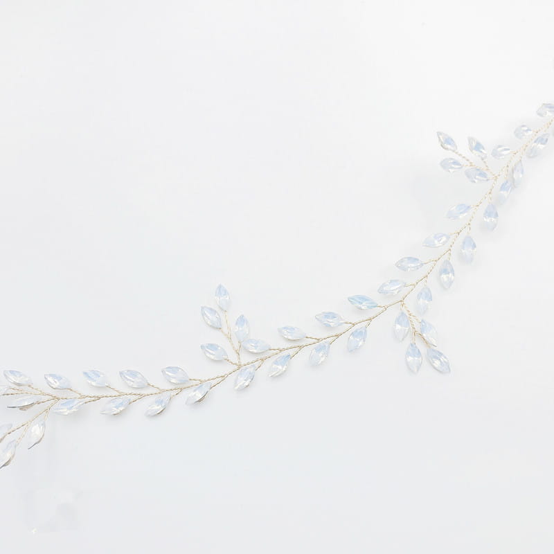 Delicate silver-toned hair band with translucent teardrop-shaped crystals featuring a protein rhinestone headdress design.