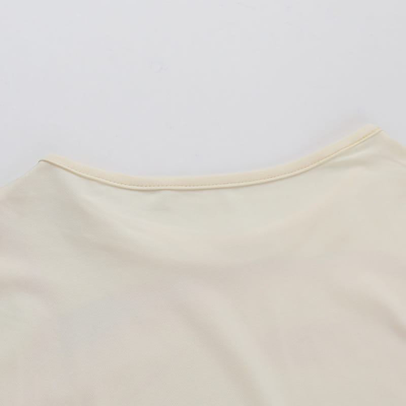 cream-colored elegant slim print floral top made of soft cotton with a simple slim print round neck design