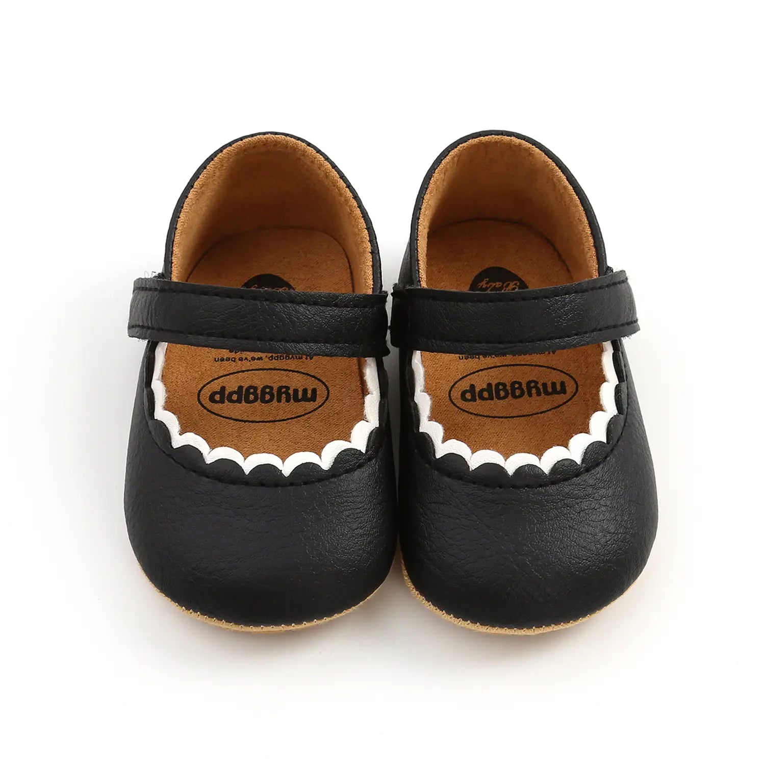 black baby princess shoes with soft leather upper and scalloped white trim designed for infants