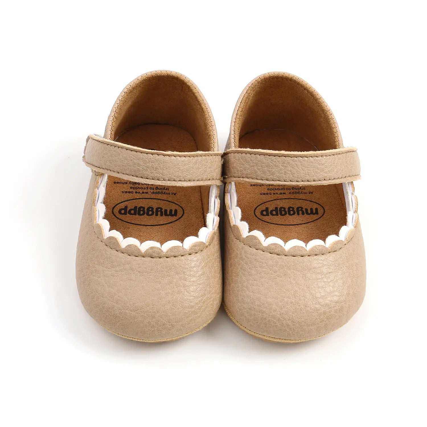 beige leather baby princess shoes with white scalloped trim made from tan leather and designed for delicate wear