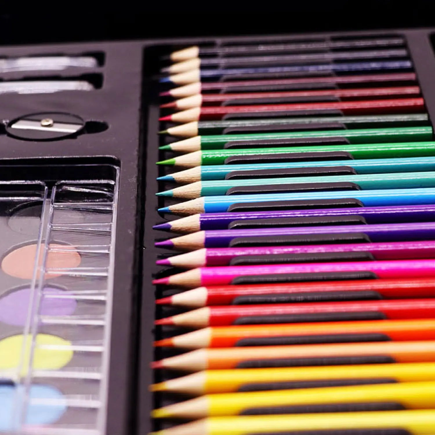 a vibrant comprehensive watercolor pen and painting set featuring 36 sharpened colored pencils with wooden barrels and colorful painted exteriors neatly arranged in a black plastic case