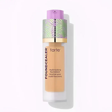 Tarte babassu foundcealer skincare foundation spf 20 in a clear glass bottle with purple cap and tropical leaf band