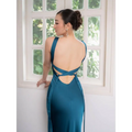 Back view of a backless strappy lake blue satin wedding dress with crisscross straps and tied details