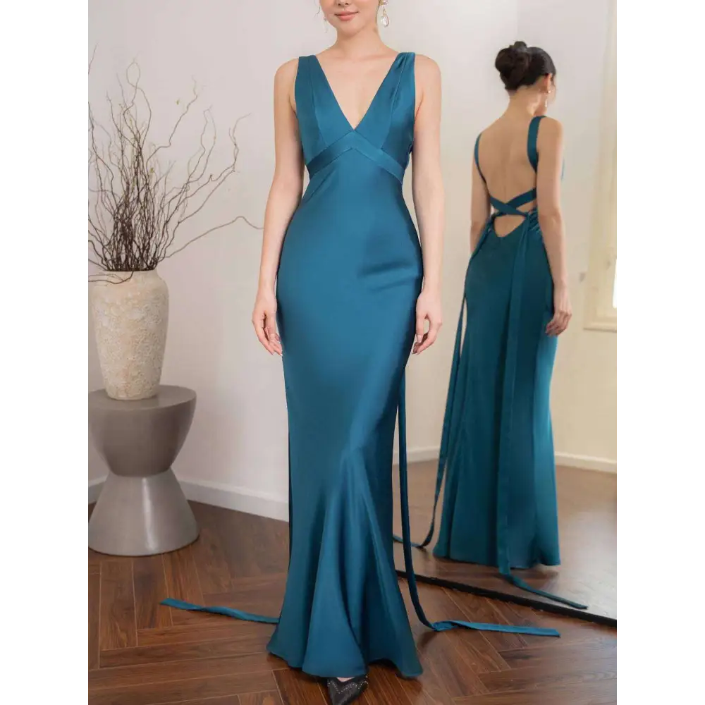 A sleek teal satin backless strappy lake blue wedding dress with deep v-neckline and back tie details