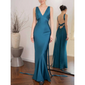A sleek teal satin backless strappy lake blue wedding dress with deep v-neckline and back tie details